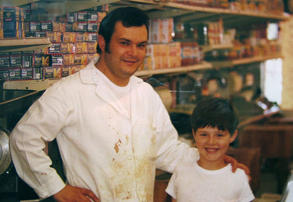 Dakota Packing CEO Carmine Romeo as a kid, working with his father, Carmine Romeo Sr. in the family butcher shop in Brooklyn.